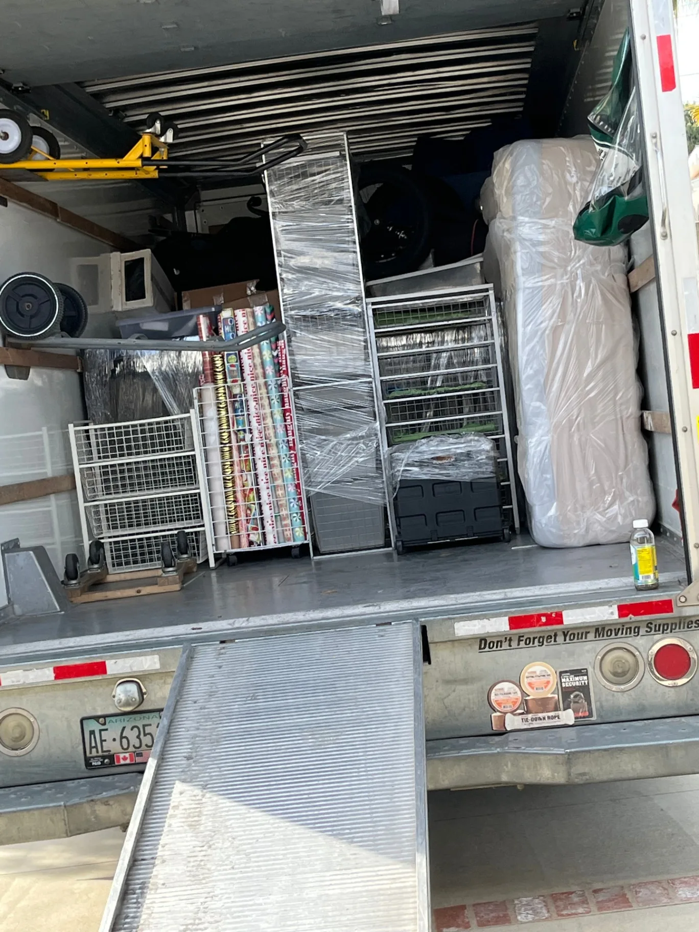 Inside a fully loaded Green Echo moving truck — furniture wrapped and stacked tightly with no shifting